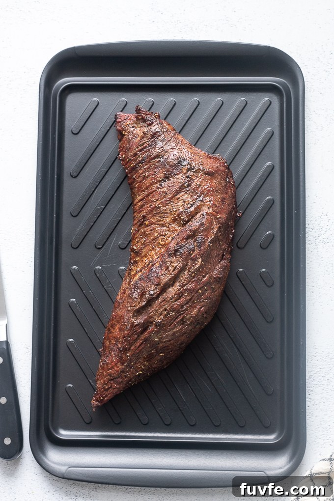 Santa maria grilled tri tip resting on cutting board.