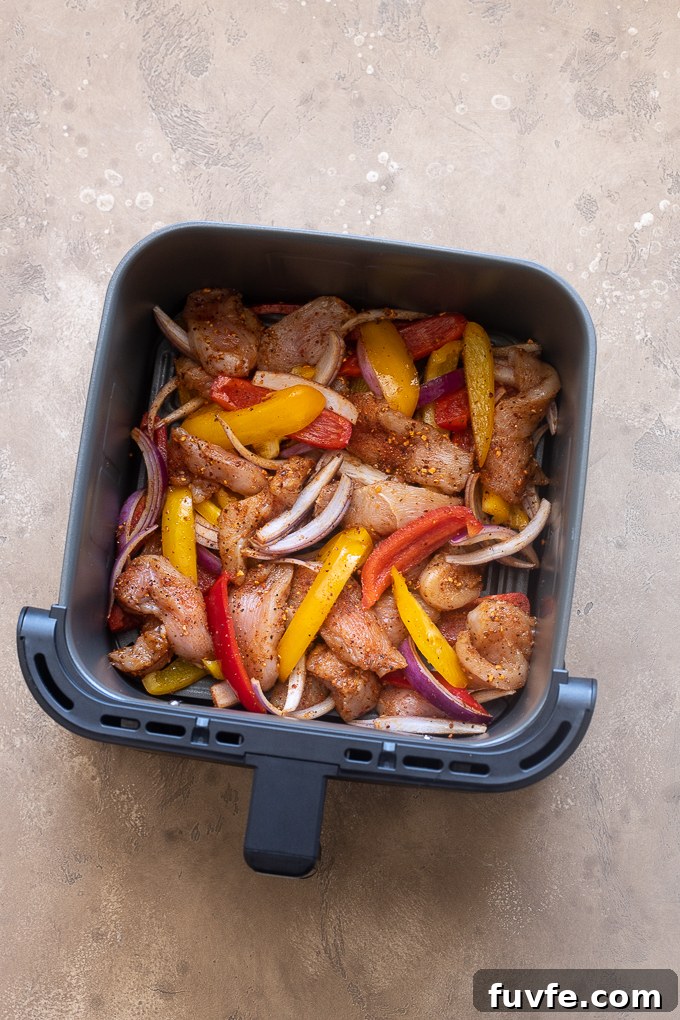 Air Fryer Chicken Fajitas Recipe: 20-Minute Dinner 8 Air fry the chicken fajita mixture.