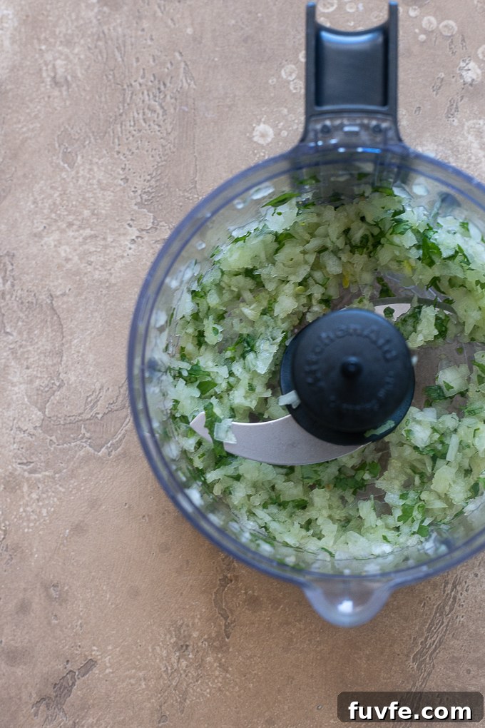 Ground cilantro, onion and garlic in food processor for lamb kofta.