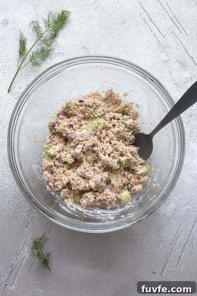 Creamy Canned Salmon Salad Recipe with Lemon and Dill 7 Prepared salmon salad in a mixing bowl.
