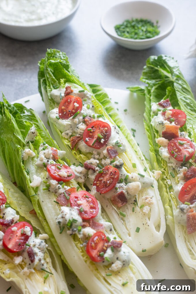 Romaine wedge salad with green goddess dressing on a platter.