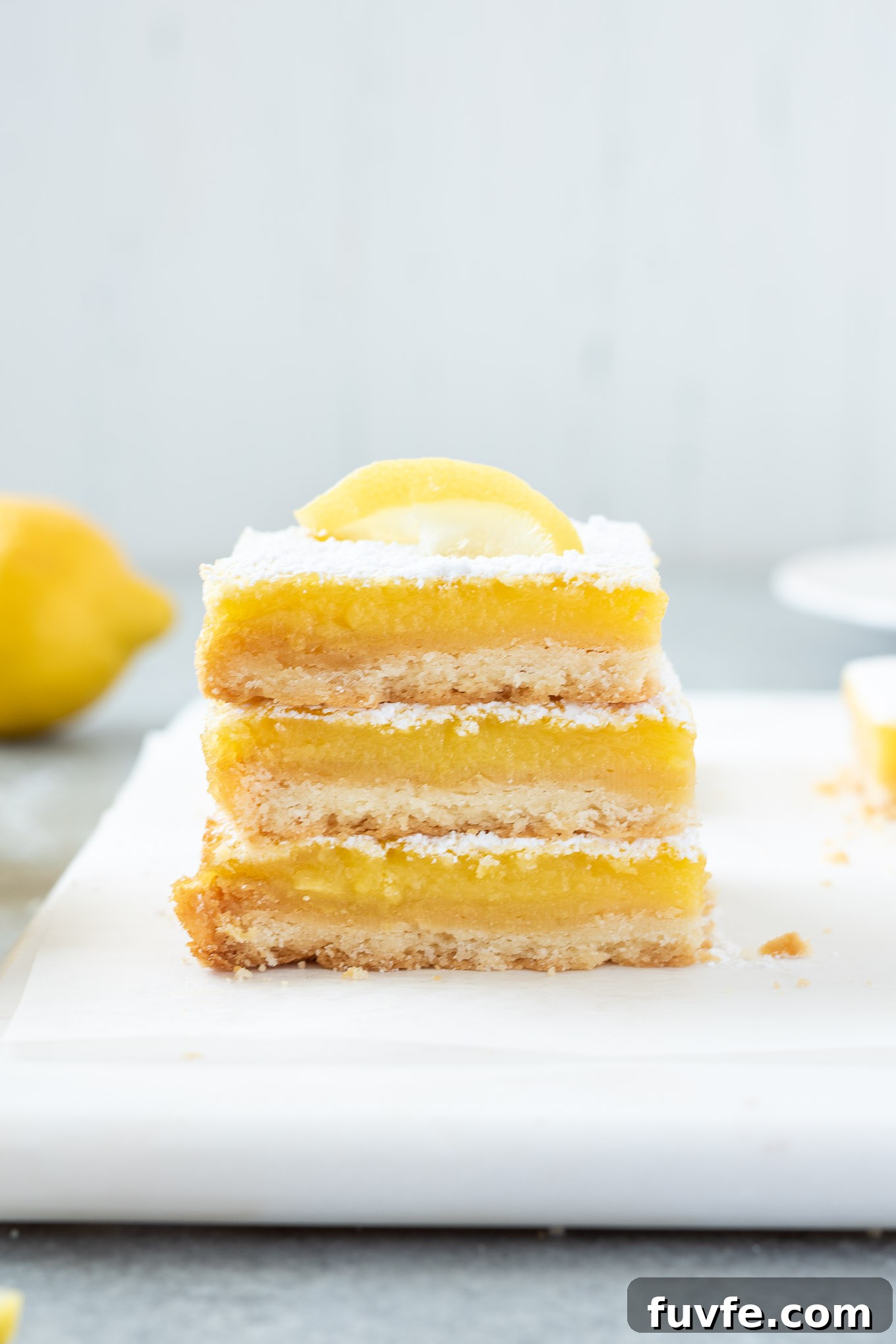 Stack of lemon bars on a platter