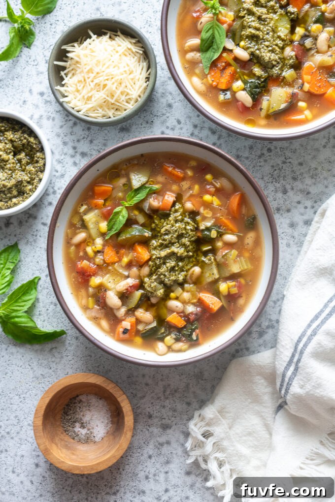 Vegetable soup with pesto in a bowl.