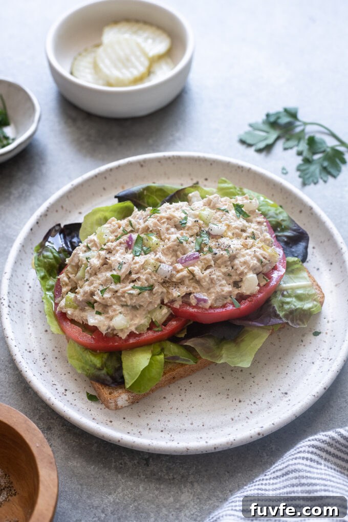 Easy tuna salad served open faced on bread.
