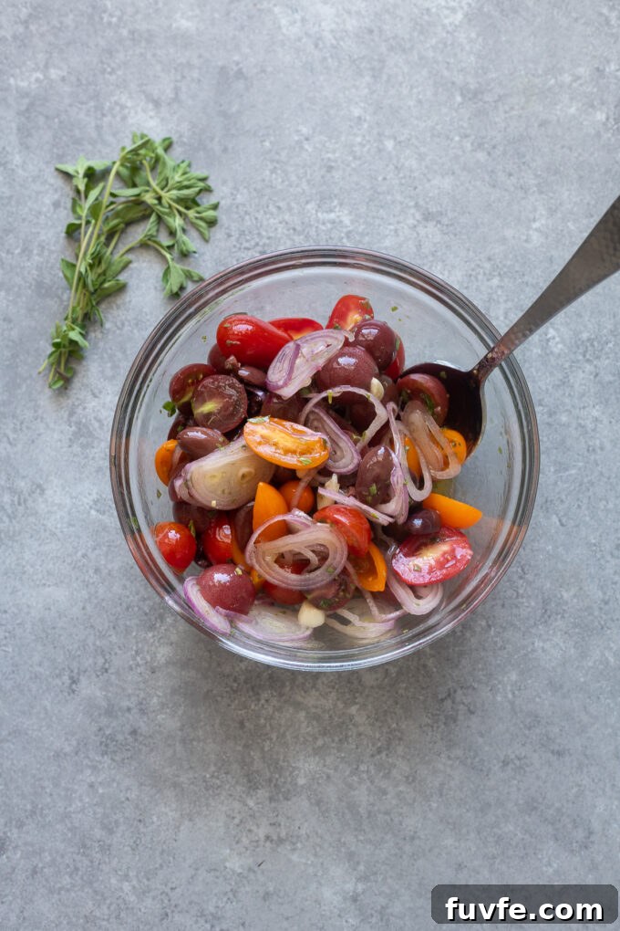Mediterranean Baked Cod with Cherry Tomatoes, Olives and Lemon 5 Combine cherry tomato mixture for baked cod with tomatoes and olives.