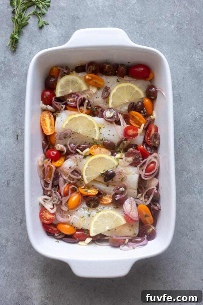 Mediterranean Baked Cod with Cherry Tomatoes, Olives and Lemon 7 Pour cherry tomato mixture over cod filets in baking dish.