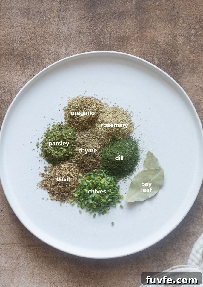 8 commonly used dried herbs labeled on a plate.
