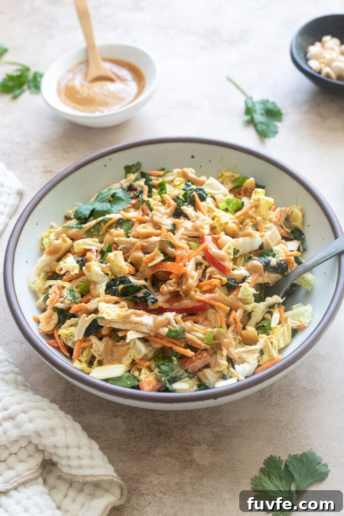 Thai chicken salad with peanut dressing in a bowl.