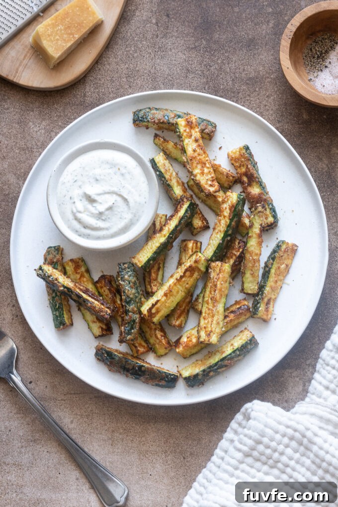 Crispy Air Fryer Zucchini Fries 3 Air fryer zucchini fries on a plate with Greek yogurt ranch dip.