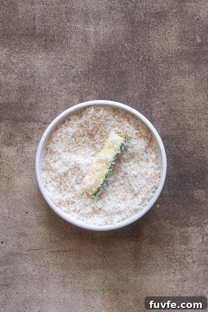 Crispy Air Fryer Zucchini Fries 7 Zucchini fries dipped in parmesan cheese and seasoning.