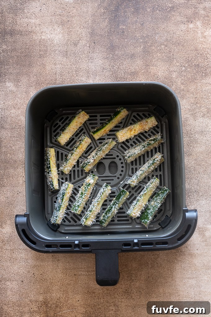 Crispy Air Fryer Zucchini Fries 8 Cooked zucchini fries in the air fryer.