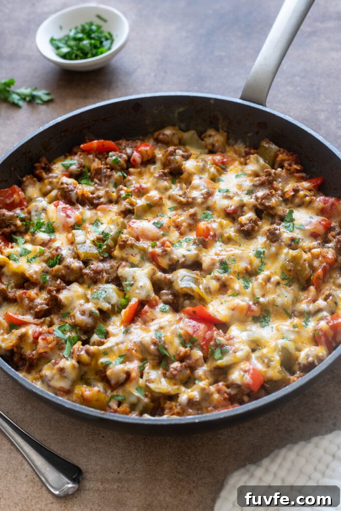Bell pepper casserole with ground beef in a skillet.