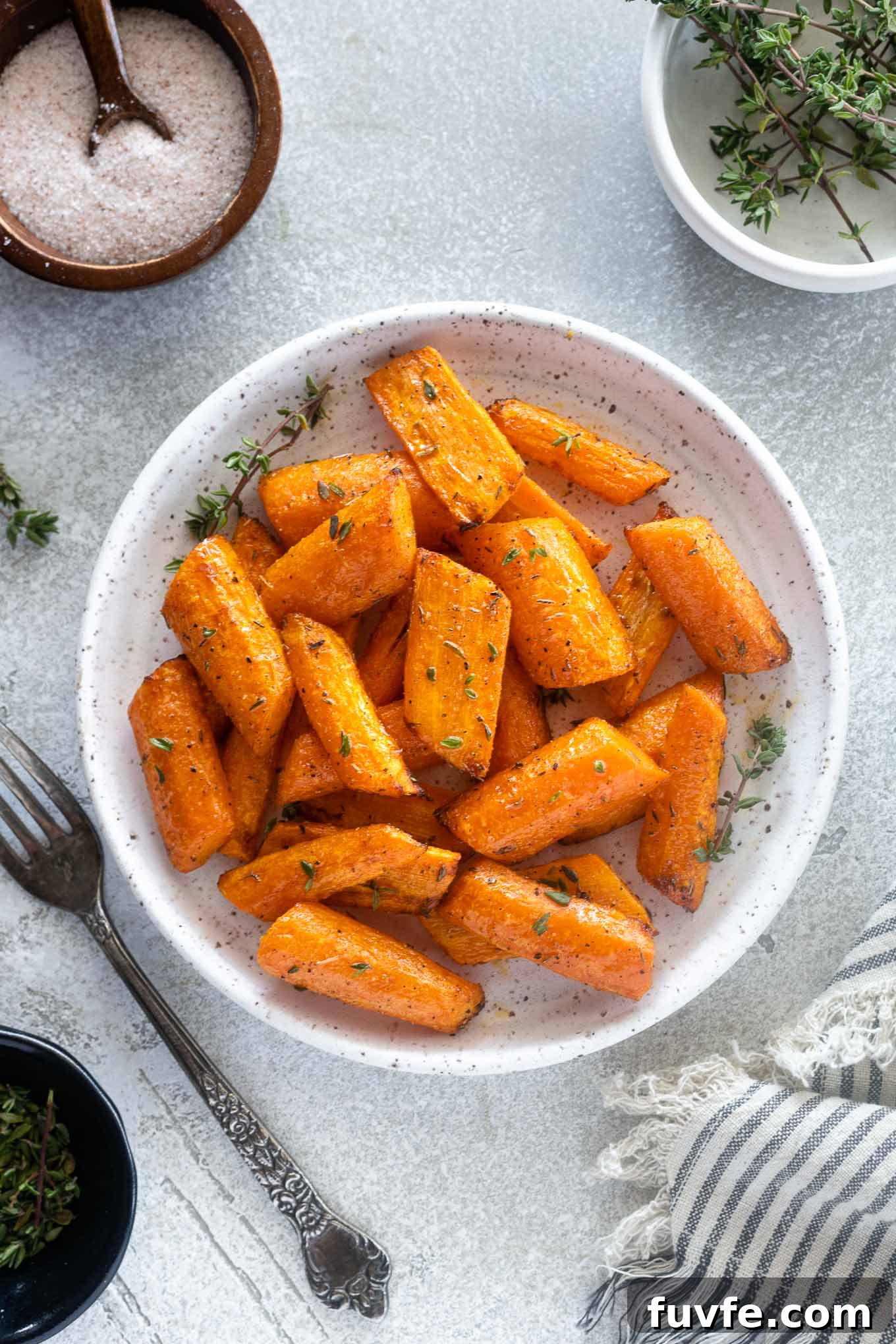 October Produce Guide: Fruits and Vegetables in Season 10 Air fryer carrots on a plate with thyme leaves