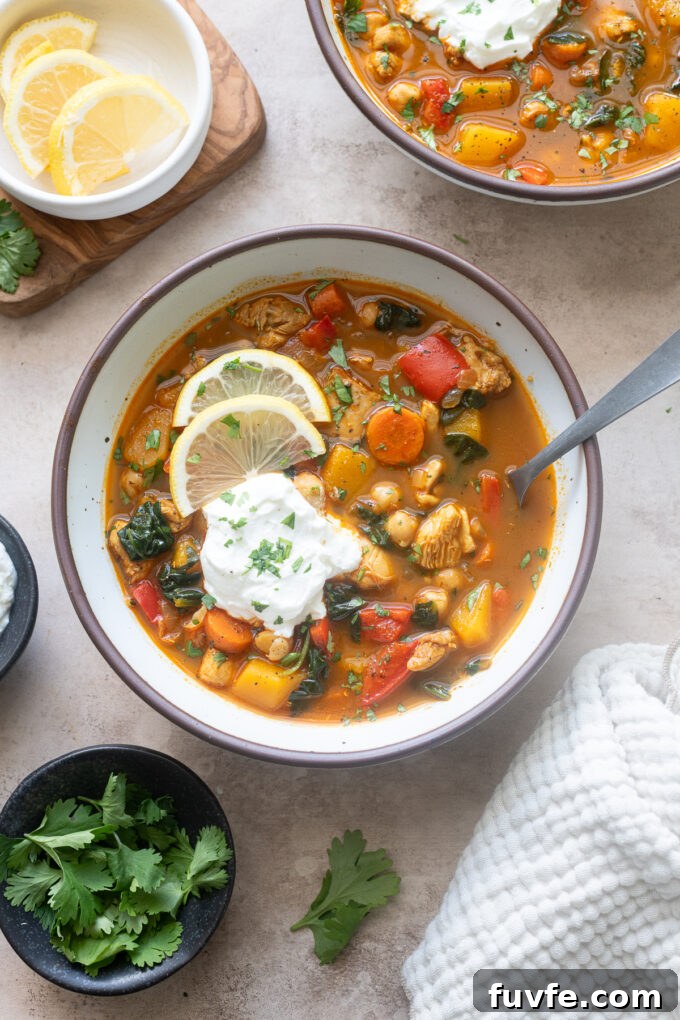 Chicken moroccan soup in a bowl with lemon and Greek yogurt.