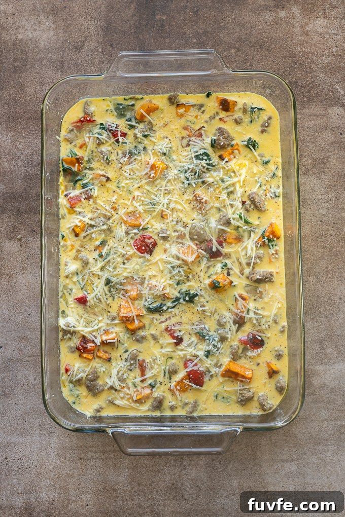 Overnight Sausage and Egg Breakfast Casserole 10 Sausage and egg breakfast casserole before baking.