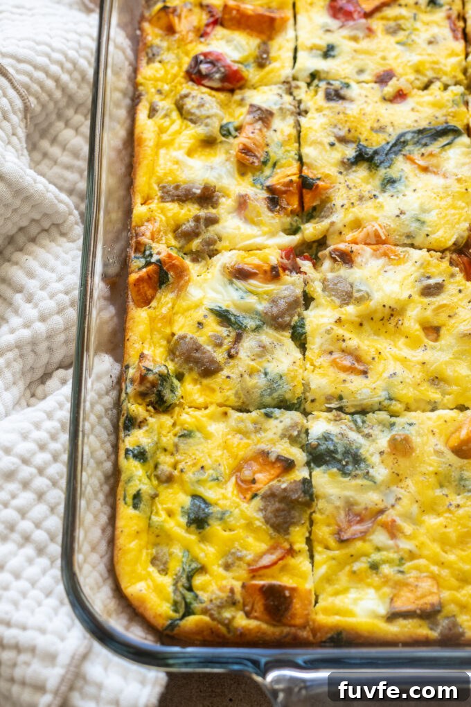 Overnight Sausage and Egg Breakfast Casserole 3 Casserole with breakfast sausage cut in a baking dish.