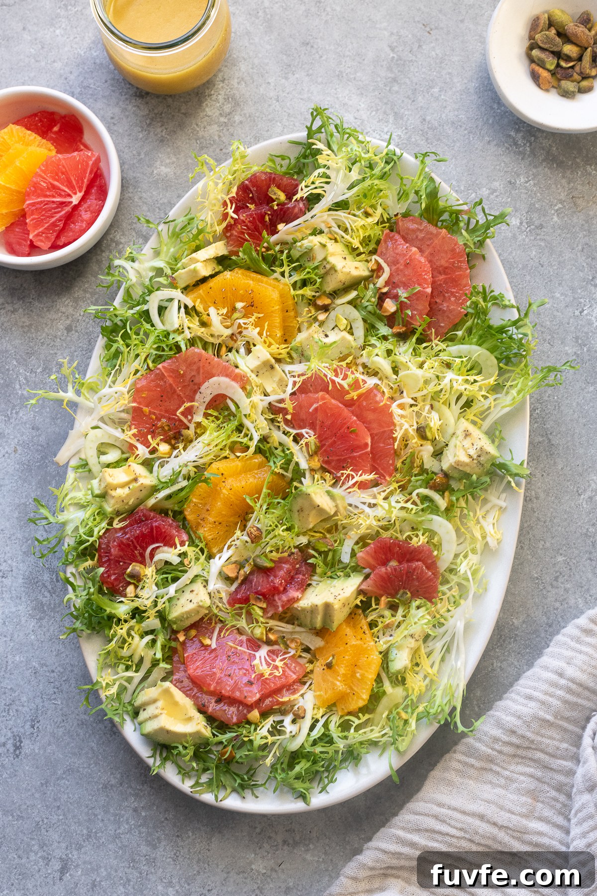 Frisée citrus salad on a platter