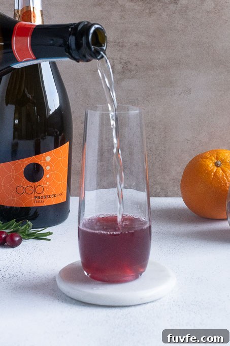 Poinsettia Cocktail Recipe: Cranberry Champagne Holiday Drink 6 Add champagne or prosecco to the cranberry juice mixture.