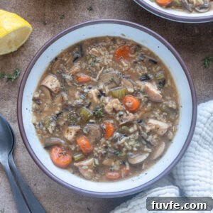 Chicken wild rice soup with no cream in a bowl.
