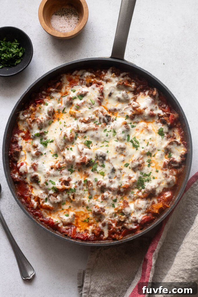 Spaghetti squash with ground beef casserole in a skillet.