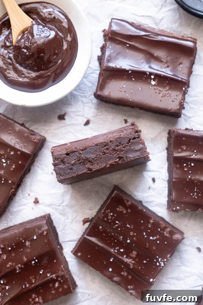 Easy chocolate ganache brownies sliced and ready to serve.