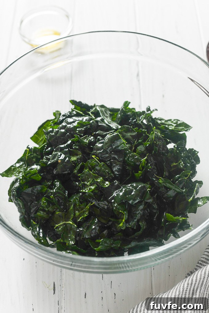 Roasted Winter Vegetables and Kale Salad 8 Massaged kale in a bowl.
