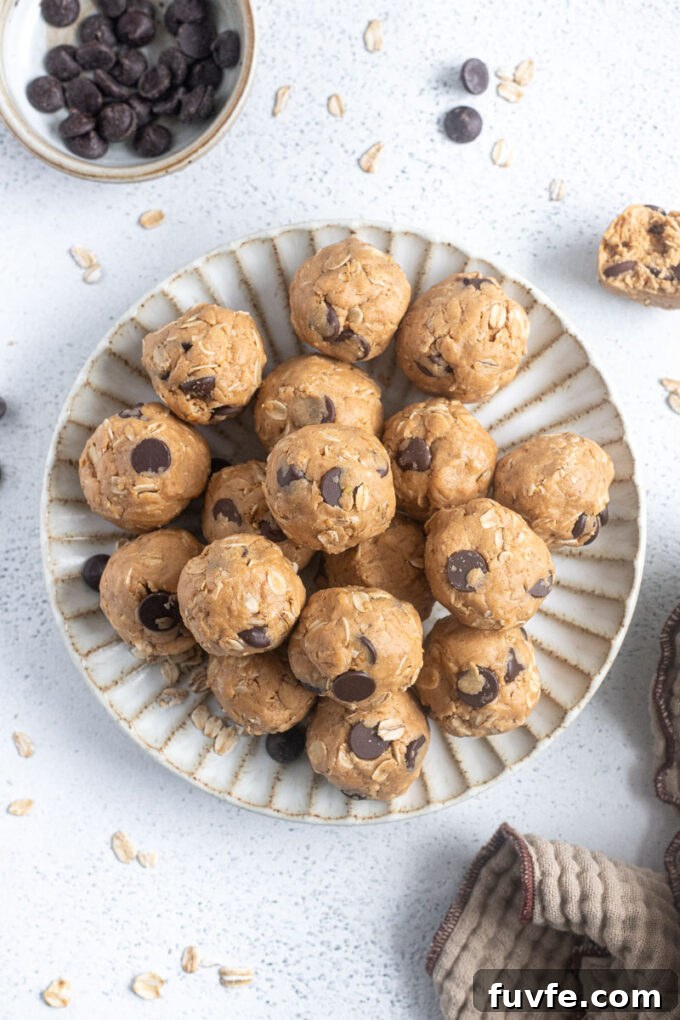 No-Bake Peanut Butter Protein Balls Recipe 3 Soft and chewy peanut butter protein balls on a plate.