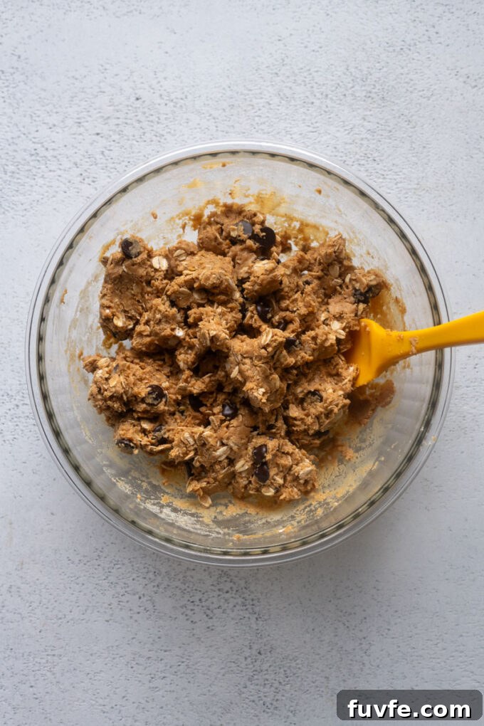 No-Bake Peanut Butter Protein Balls Recipe 6 Peanut butter protein ball dough combined in a bowl.