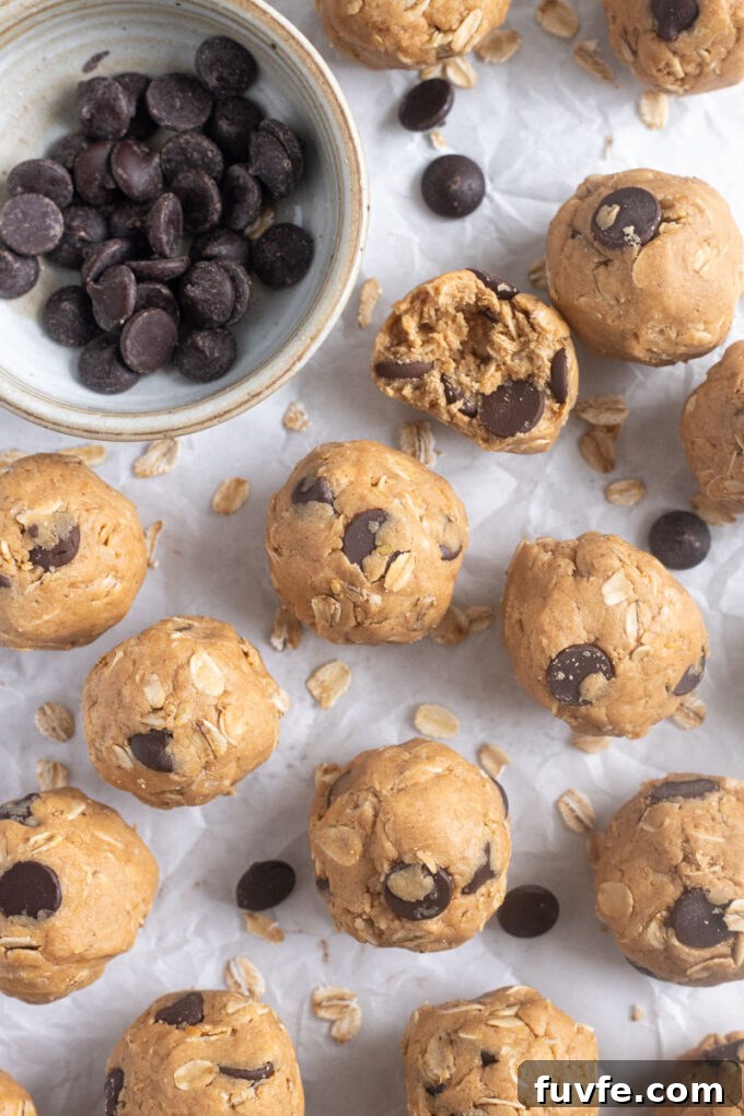 No-Bake Peanut Butter Protein Balls Recipe 8 No-bake peanut butter protein balls on parchment paper.