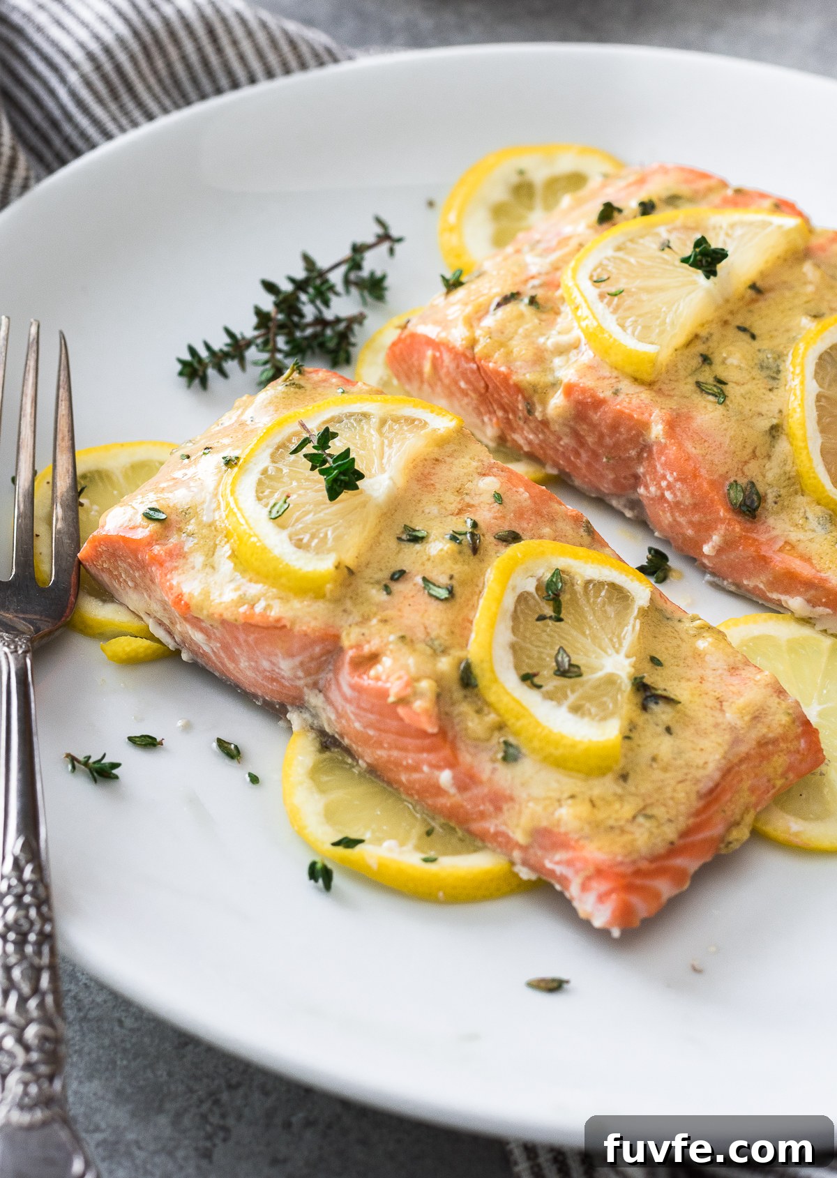 Baked dijon salmon on a plate.