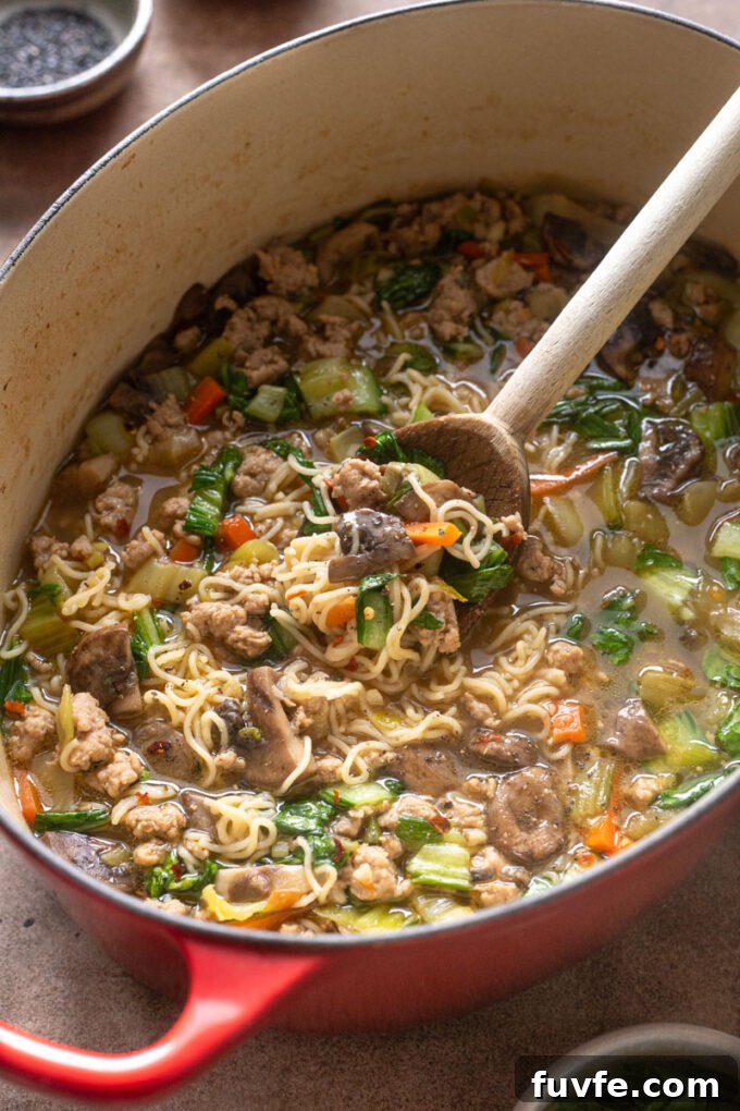 Ground pork ramen with bok choy in Dutch oven.