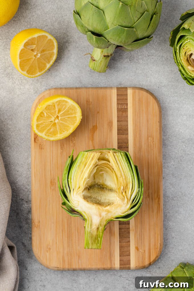 How to Prepare Artichokes for Cooking 10 Halved artichoke with choke removed showing artichoke heart.