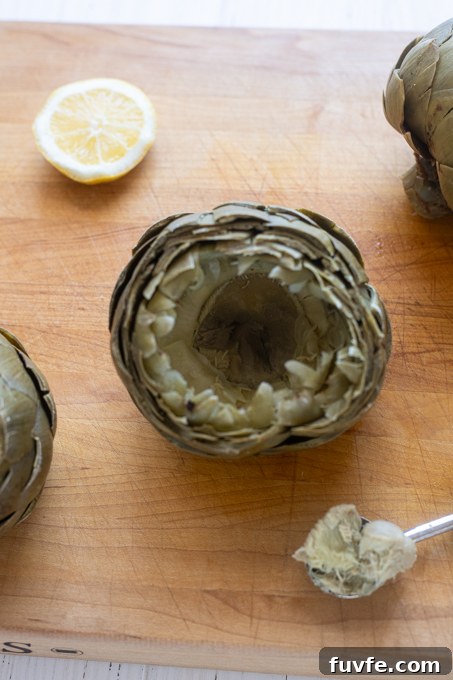 How to Cook Tender Instant Pot Artichokes 13 Steamed artichoke with fuzzy choke removed.