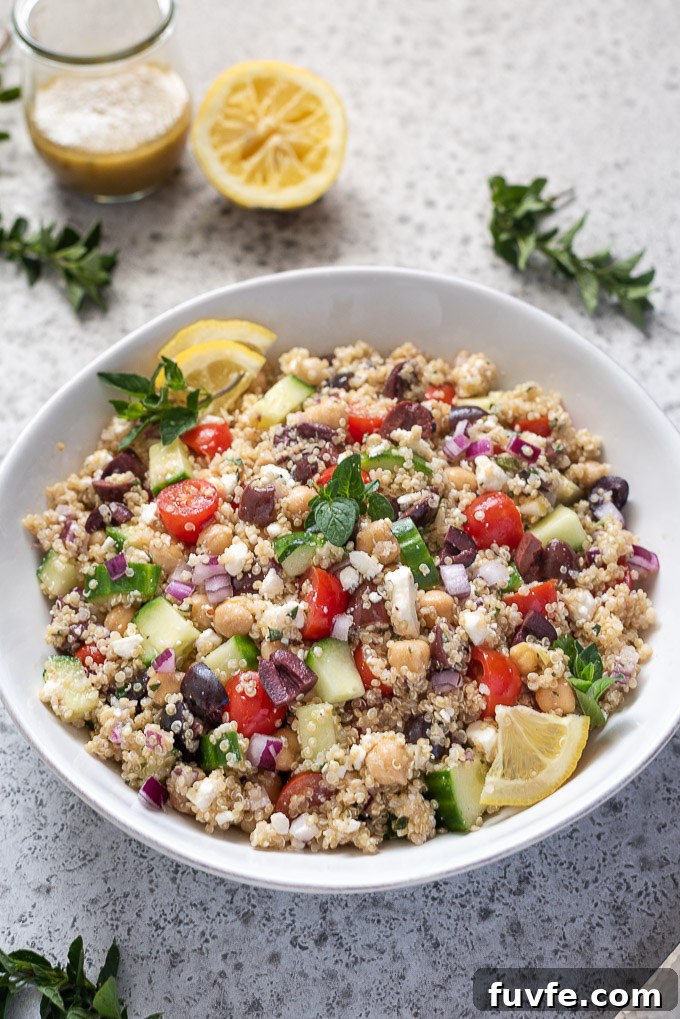 Greek quinoa salad with lemon slices and oregano on top