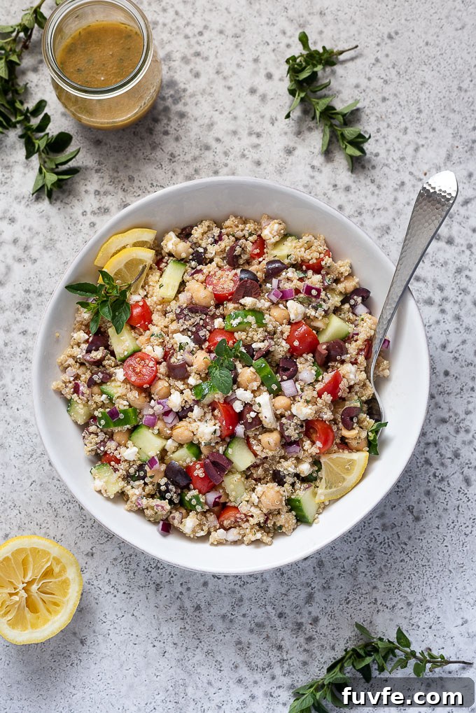 Greek quinoa salad with Greek dressing and oregano alongside
