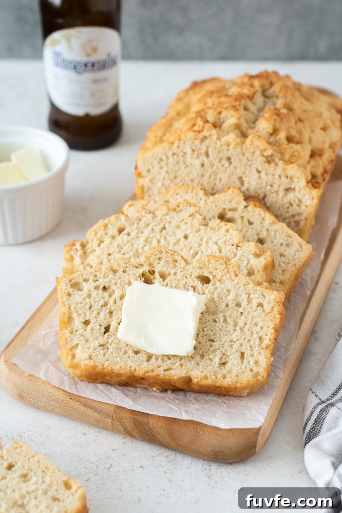Slice of beer bread with a pat of butter