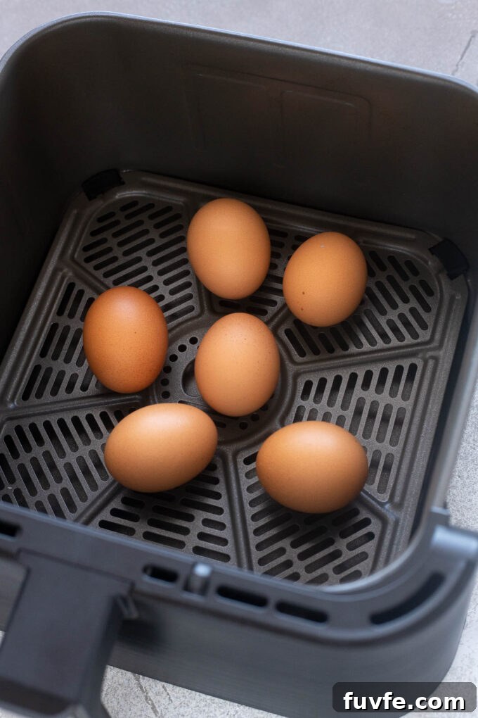 Hard boiled eggs in air fryer basket after cooking.