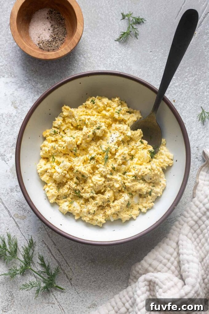 Creamy egg salad with dill and horseradish in a serving bowl.