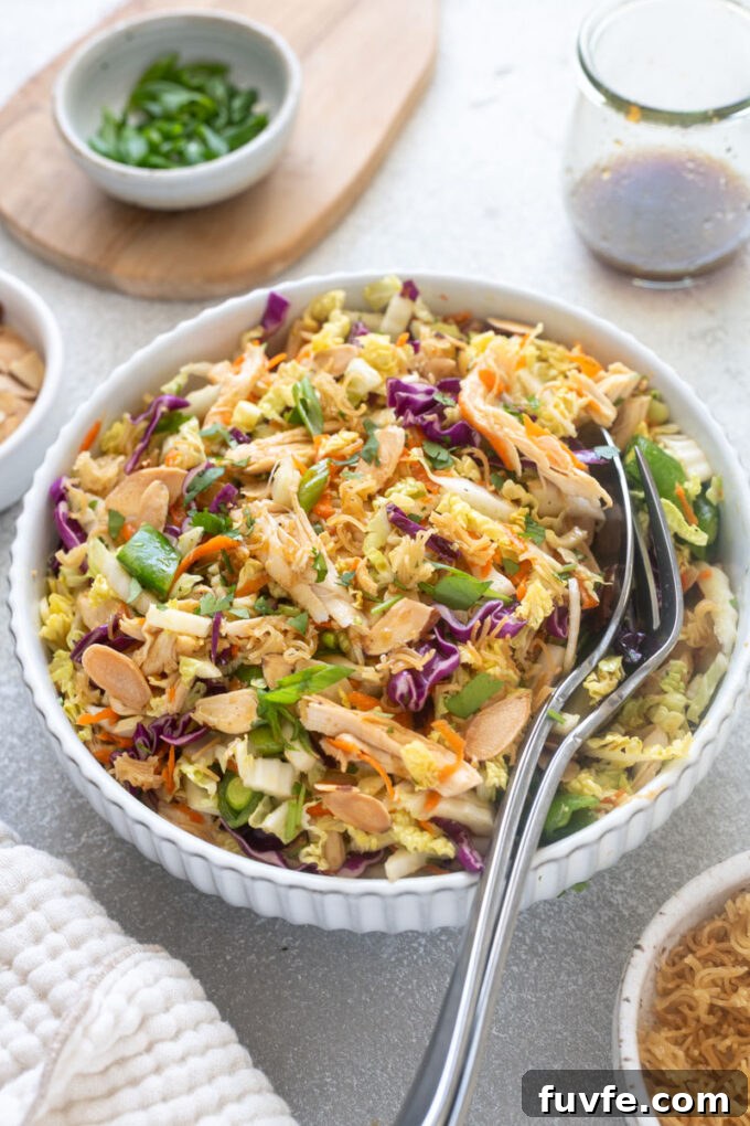 Chinese chicken salad with ramen noodles in a bowl.