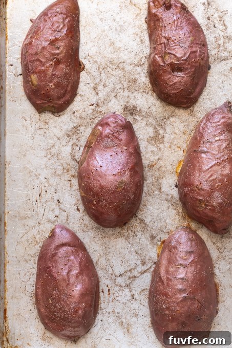 Oven roasted sweet potato halves skin side up after baking.
