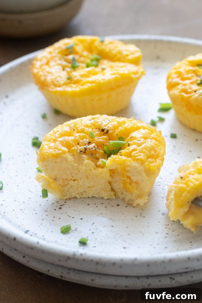 Close up of a soft and creamy cottage cheese egg bite showing the fluffy custardy center.
