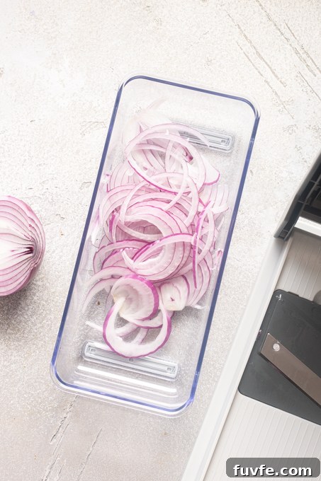 Red onion sliced with a mandoline.