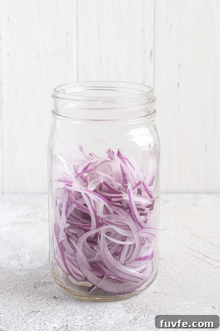 Sliced onions in a jar.