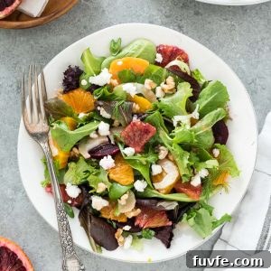 Roasted beet salad on a plate with a fork