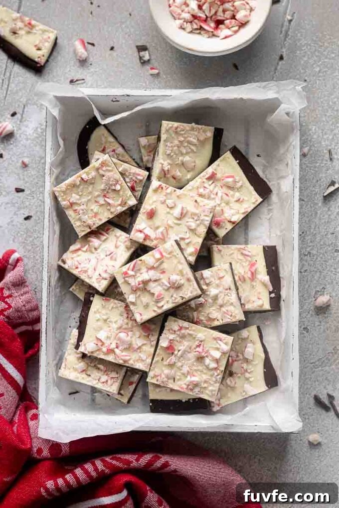 Easy peppermint bark in a white box with crushed candy cane.
