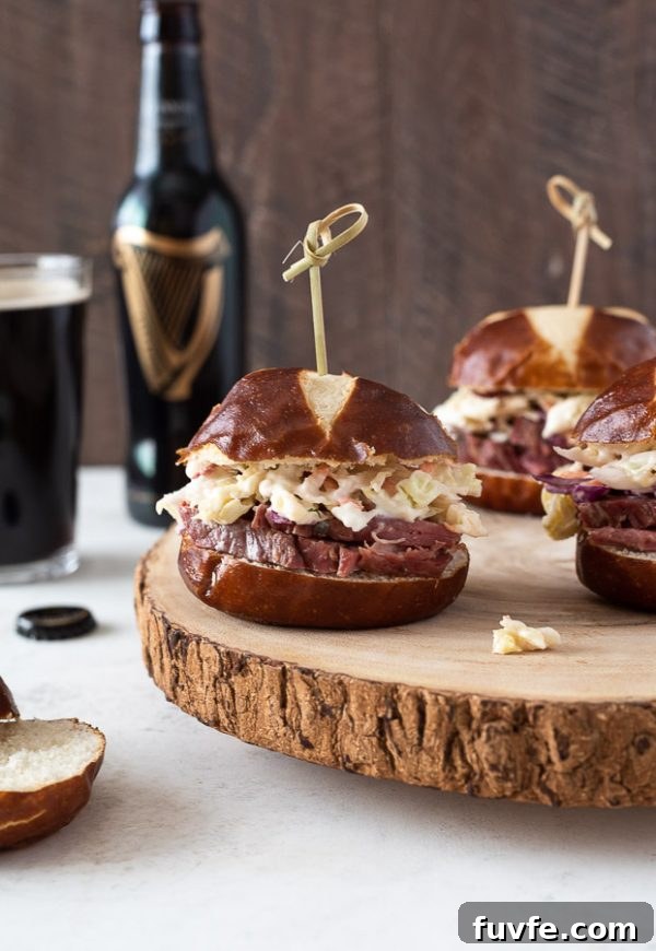 Reuben Style Corned Beef Sliders with Swiss and Sauerkraut 6 close up of guinness corned beef sliders with wooden pick