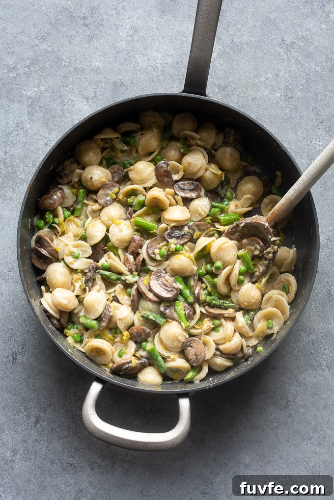 One-Pot Spring Pasta Primavera Recipe with Fresh Veggies 8 Finished dish with the cooked vegetables, lemon and basil.