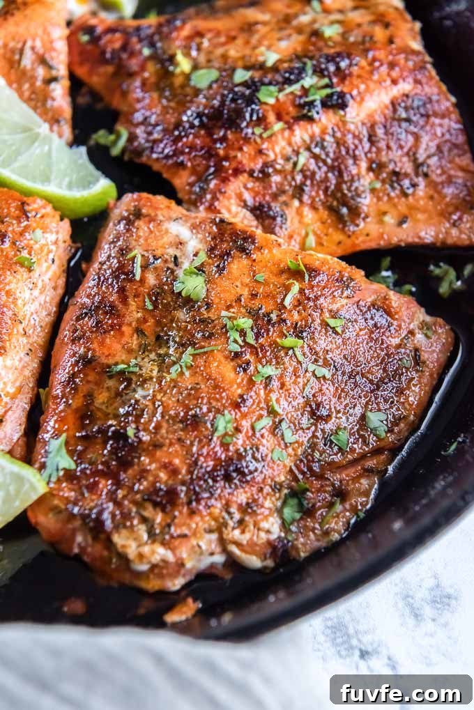 Blackened Salmon with Cajun Spice and Lemon Butter 6 Blackened salmon in the skillet with parsley and lime
