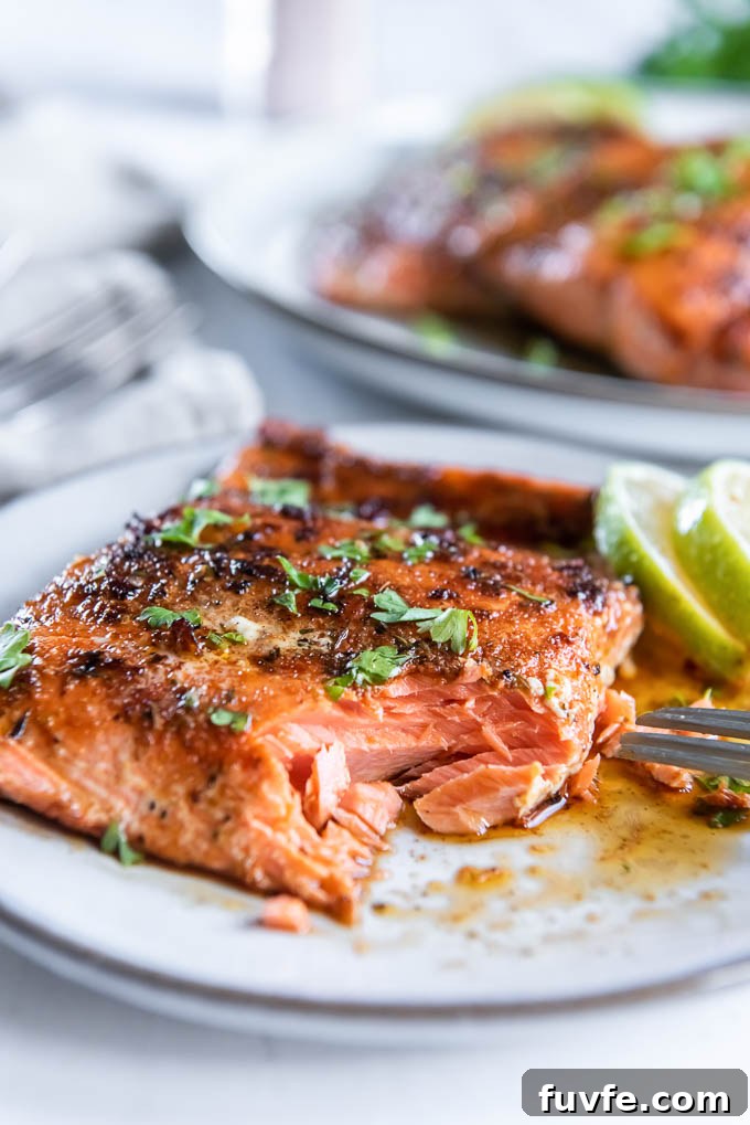 Blackened Salmon with Cajun Spice and Lemon Butter 8 Blackened salmon on a plate with a bite taken out