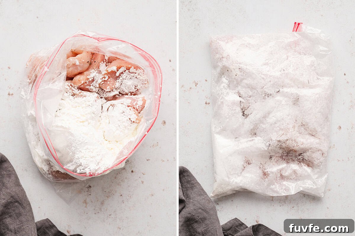 Coating the chicken in cornstarch.